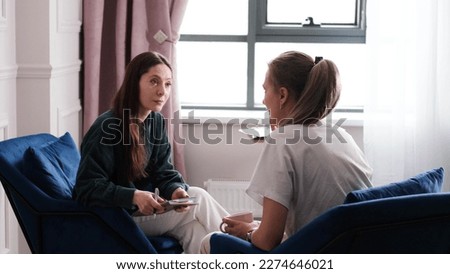 A woman psychotherapist conducts a reception in her office. The patient expresses her feelings in a one-on-one relationship with a specialist. Mental health concept Royalty-Free Stock Photo #2274646021