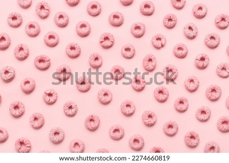 Many cereal rings on pink background