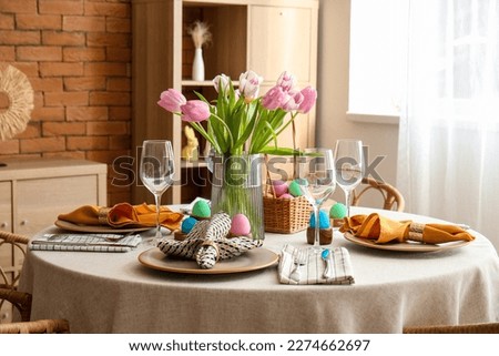 Interior of dining room with table served for Easter celebration Royalty-Free Stock Photo #2274662697