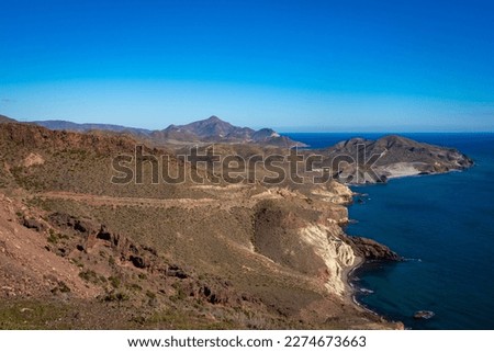 Beautiful scenic coastline and hills of Faro de Cabo de Gata and national park Royalty-Free Stock Photo #2274673663