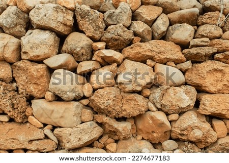 pile wall retaining wall stones arranged in a row