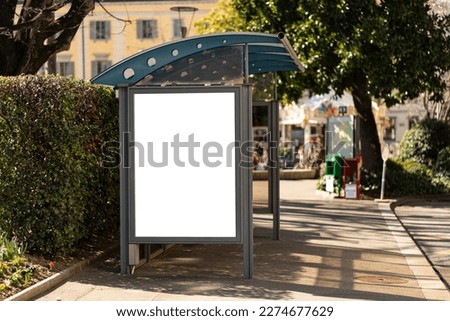 Portrait format billboard at a bus stop in Lugano, Ticino, Switzerland