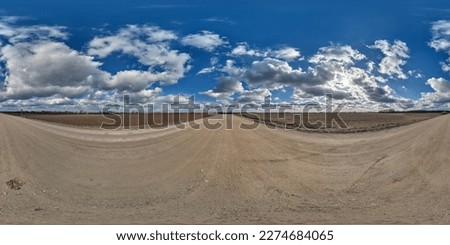spherical 360 hdri panorama on gravel road with clouds and sun on blue sky in equirectangular seamless projection, use as sky replacement in drone panoramas, game development as sky dome or VR content