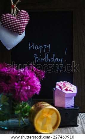 Hearts on the blackboard and note with chalk