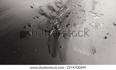 Water drops on black plastic. Surface with wet background. Abstract texture and pattern full of water. Raindrops of rain for overlaying on window with partial focus. Concept of autumn weather
