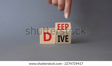 Deep Dive symbol. Businessman hand. Concept words deep dive on wooden cubes. Beautiful grey background. Business and Deep Dive concept. Copy space