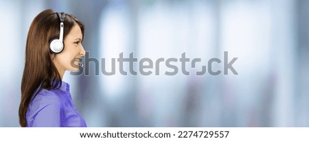 Call Center Service. Profile side portrait image of customer support or answer worker, sales agent. Caller, receptionist phone operator. Helpline answering, telemarketing, blurred office background