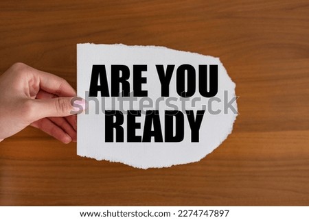 Are you ready. Woman hand holds a piece of paper with a note. motivation, Expectation, opportunity, chance, determination and conquering adversity.