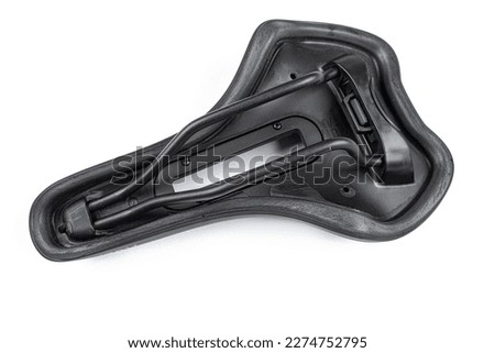 Brand new bicycle black seat isolated above white background.