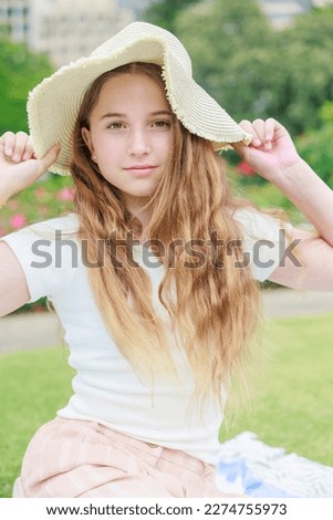 Australian girl wearing a straw hat (Vertical photo)