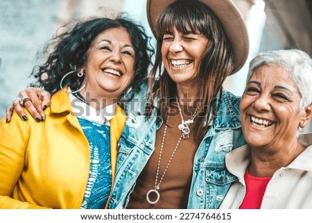Three senior women having fun laughing out loud outside - Happy female friends talking together walking on city street - Life style concept with mature females hanging outdoors on summer holiday