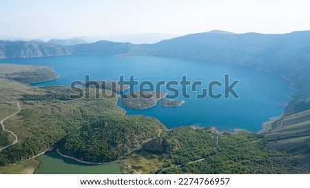 The world famous Nemrut Crater Lake has a unique view.There are 3 lakes in Nemtur Crater, where a dense layer of fog covers the morning.