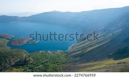 The world famous Nemrut Crater Lake has a unique view.There are 3 lakes in Nemtur Crater, where a dense layer of fog covers the morning.