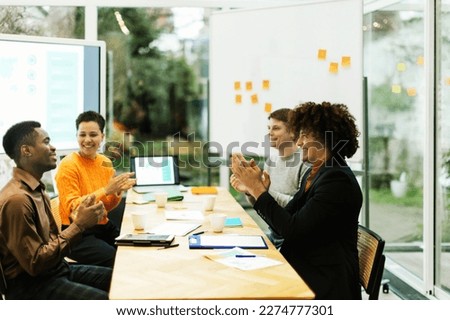 group of positive colleagues at work in the office Royalty-Free Stock Photo #2274777301
