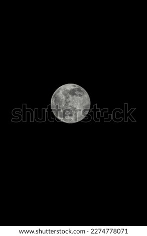 Full moon with dark background.
