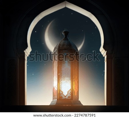 Ornamental Arabic lantern with burning candle glowing at night mosque background. Festive greeting card, invitation for Muslim holy month Ramadan Kareem. Royalty-Free Stock Photo #2274787591