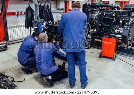 Process of assembling or repair engine in the factory. Royalty-Free Stock Photo #2274795393
