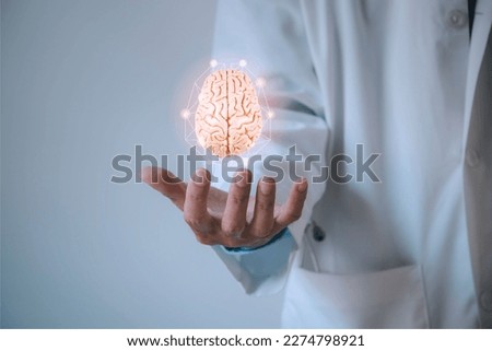 Doctor showing human brain network model. Medical technology concept. Royalty-Free Stock Photo #2274798921