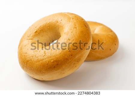 plain bagel on a white background Royalty-Free Stock Photo #2274804383