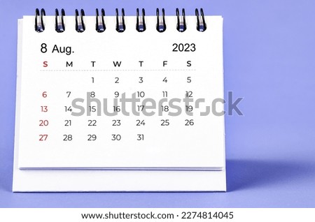 August 2023 Monthly desk calendar for 2023 year on purple background. Royalty-Free Stock Photo #2274814045