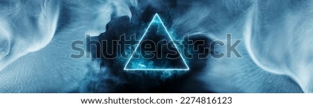 Energy geometric triangle on a dark background. Beautiful futuristic swirling smoke. Mockup for titles, product and logo.  Texture for designer background. Royalty-Free Stock Photo #2274816123