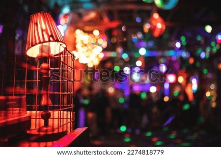 Blurred defocused bar background with night club lights and interior element. Nightlife, ruin pubs concept. Royalty-Free Stock Photo #2274818779