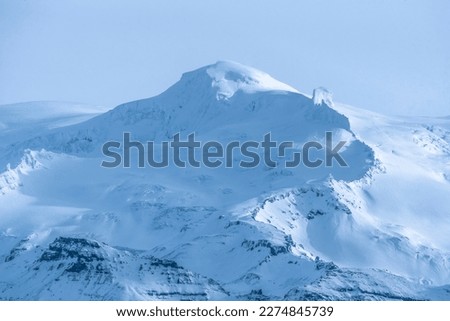 Snowed mountain top icelandic mountain landscape in winter time