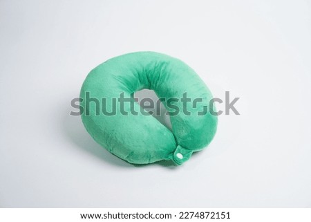 Travel colorful sleeping pillow or Neck Pillow on grey background. Royalty-Free Stock Photo #2274872151