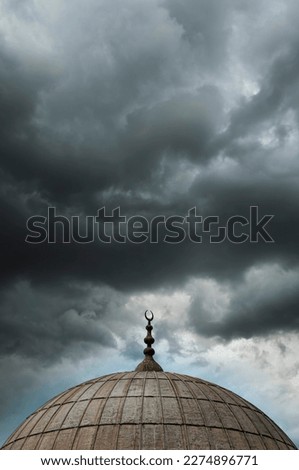A dome from one of the many Mosques in Istanbul against a overcast sky background.