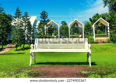 Beautiful White bench in garden.