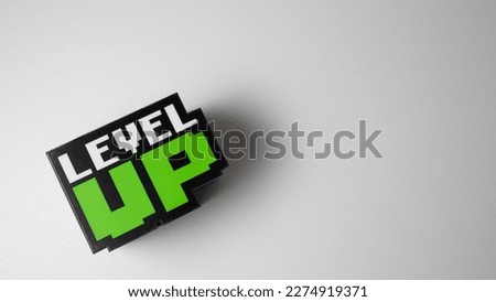 Word: ''Level up'' cube with a with background and space for text Royalty-Free Stock Photo #2274919371