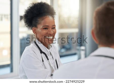 Doctor, happy black woman and meeting healthcare team for hospital management, medicine and discussion. Female surgeon, smile and talking to employees in collaboration, surgery and medical planning