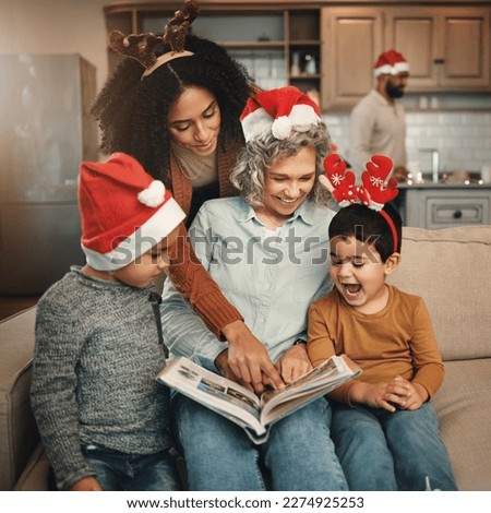 Happy, christmas and family looking at a photo album for memories, nostalgia and bonding. Smile, festive and mother, grandmother and children excited to look at pictures of relatives in a book