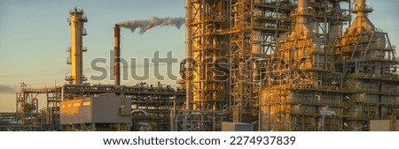 Modern chemical industry complex in the light of the setting sun-panorama Royalty-Free Stock Photo #2274937839