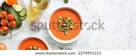 Gazpacho soup in bowl over light stone background with copy space. Cold tomato soup. Top view, flat lay Royalty-Free Stock Photo #2274951313