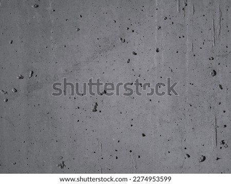 Grey concrete wall texture for background. Concrete stone background with cracks and irregularities.