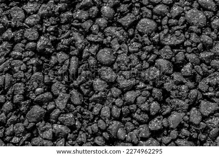 Freshly laid asphalt close-up as a background Royalty-Free Stock Photo #2274962295