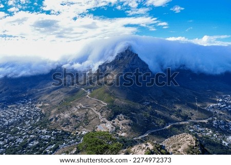 Iconic Table Mountain in Cape Town, South Africa, with dramatic "tablecloth" clouds; as seen from Lion's Head