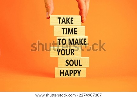 Make your soul happy symbol. Concept words Take time to make your soul happy on wooden blocks on a beautiful orange table orange background. Businessman hand. Business make your soul concept.