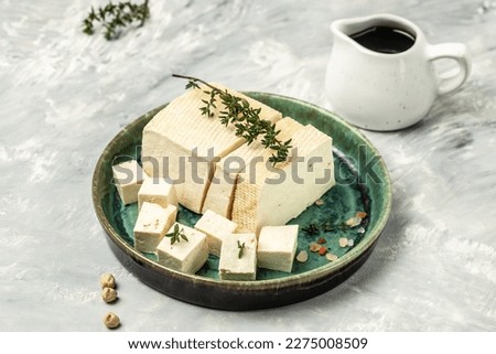 Tofu with bean on a light background, Culinary vegan and vegetarian eating, banner, menu, recipe place for text, top view,