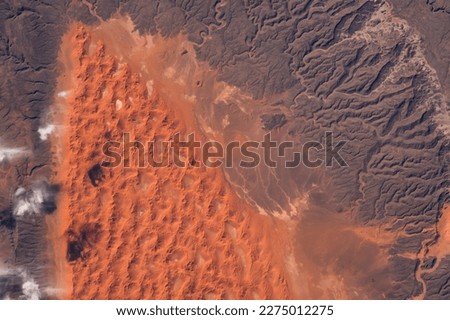 Sahara Desert in Algeria aerial view. Earth landscape. Selective focus included. Elements of this image furnished by NASA Royalty-Free Stock Photo #2275012275