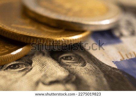 Close up of a North American money bill. with some coins on top. Physical money concept. Royalty-Free Stock Photo #2275019823
