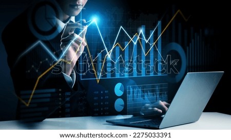 Businessman analyst working with digital finance business data graph showing technology of investment strategy for perceptive financial business decision. Digital economic analysis technology concept. Royalty-Free Stock Photo #2275033391