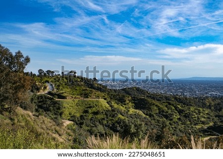 A view of the city of Los Angeles on a sunny day in the afternoon.
