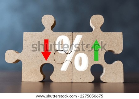 Puzzle with percent and up or down arrow. Mortgage and loan rates. Interest rate, stocks, ranking. Financial, ranking, mortgage rates and Cut loss concept