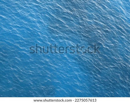 Blue ocean water texture background. Surface of the sea. Royalty-Free Stock Photo #2275057613