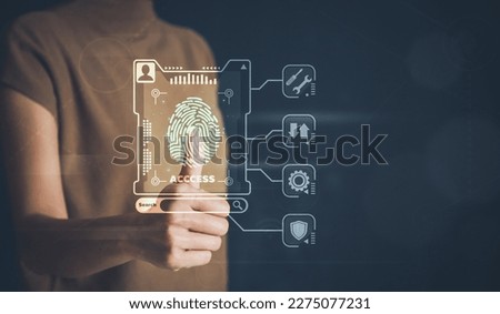 Businessman thumb login with fingerprint scanning technology. fingerprint to identify personal, security system concept Royalty-Free Stock Photo #2275077231