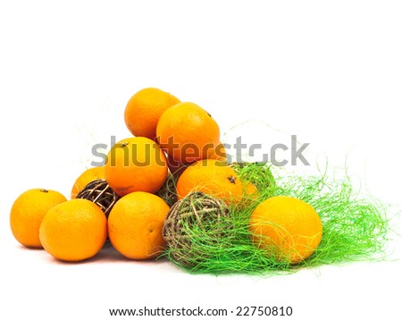 new year orange mandarin decoration with golden ball in green