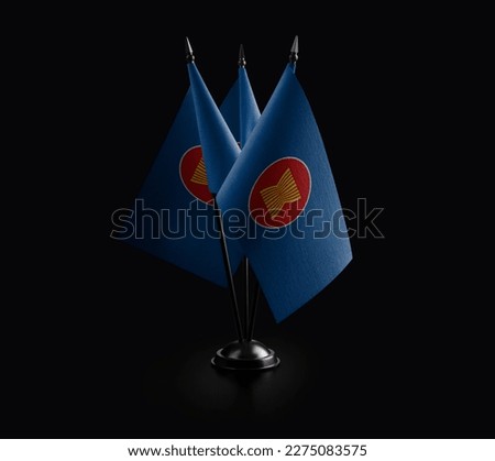 Small national flags of the ASEAN on a black background. Royalty-Free Stock Photo #2275083575