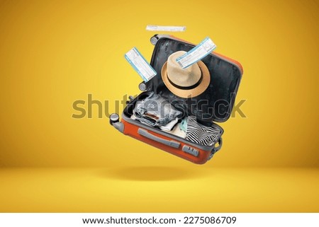 	
suitcase with yellow background and empty space for text shades of yellow background Royalty-Free Stock Photo #2275086709